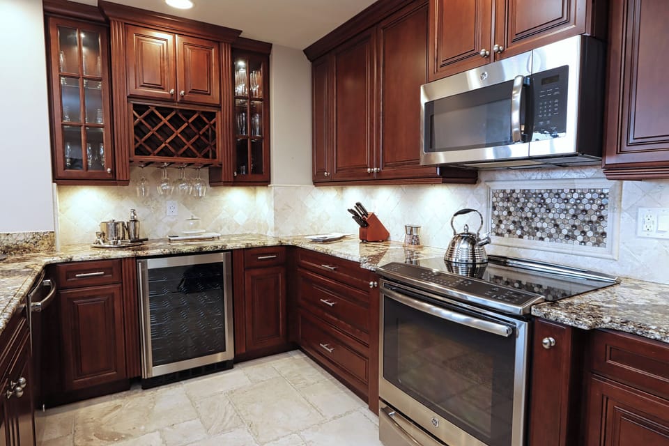 Kitchen with stainless steel appliances and wine cooler