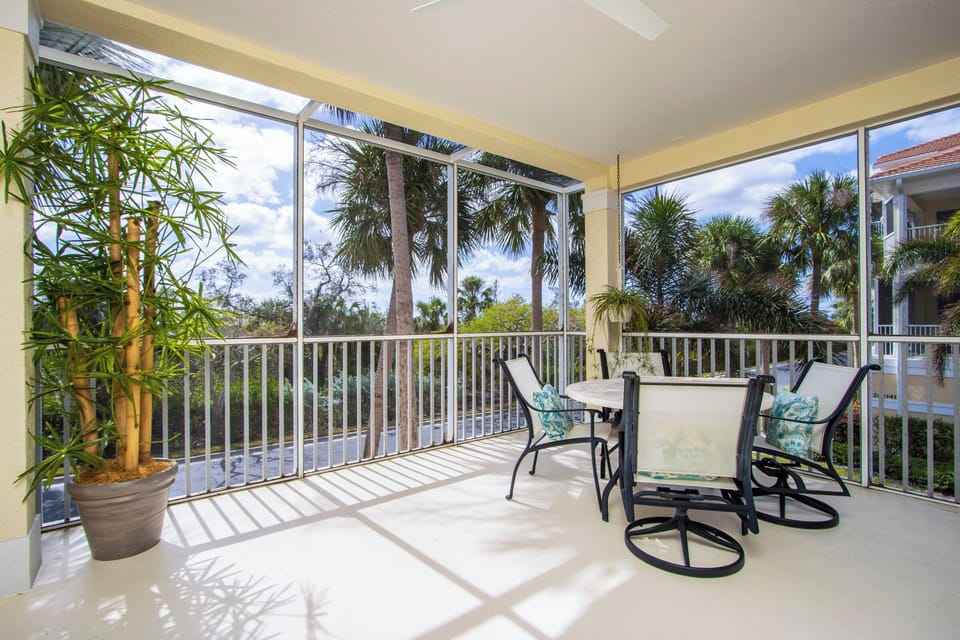 Screened lanai with outdoor dining table
