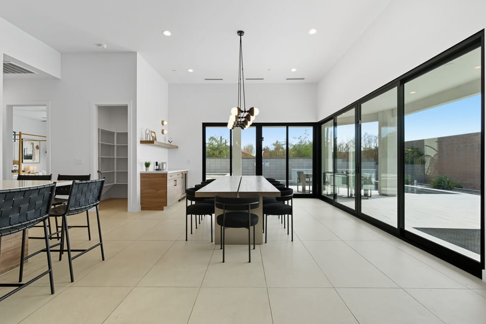 Formal dining room featuring a large table to accommodate up to 10 guests.