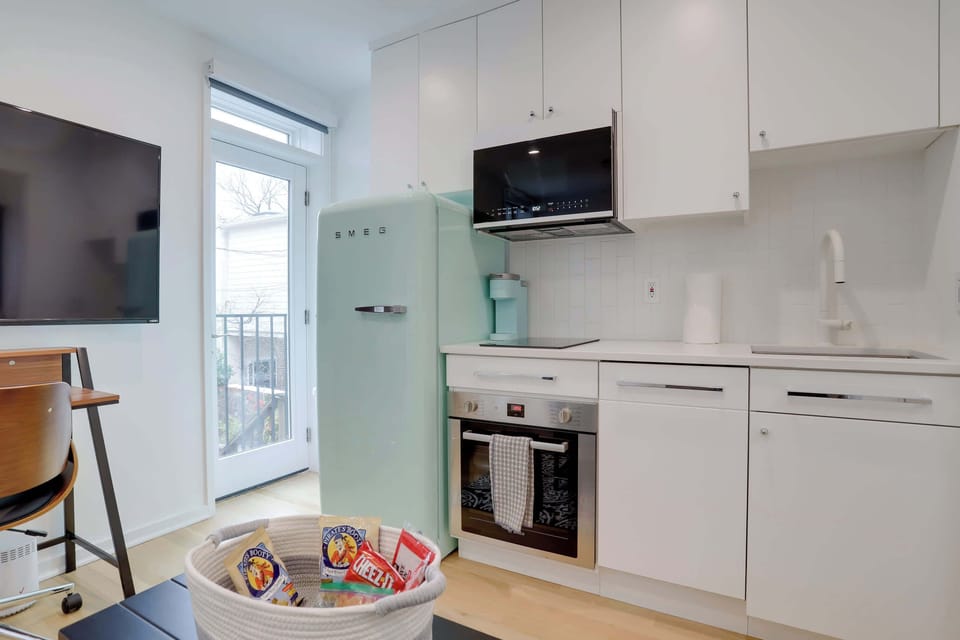 Kitchen with a view of the front door. 