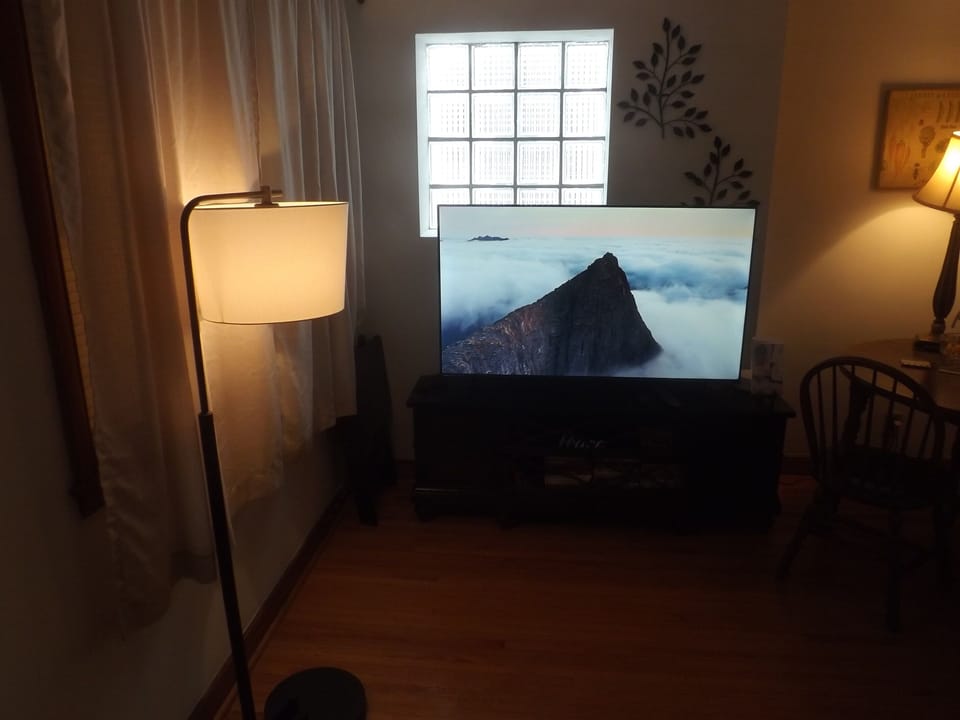 Reclining sofa with large Roku smart TV in living room