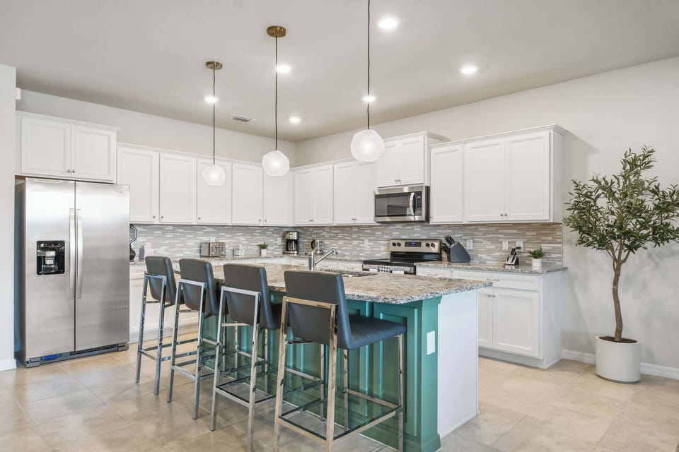 Prepare meals while staying connected with guests in the open living and dining areas
