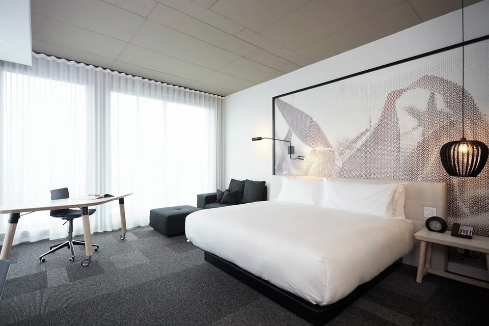 Wake up refreshed in a sunlit room with airy comfort.