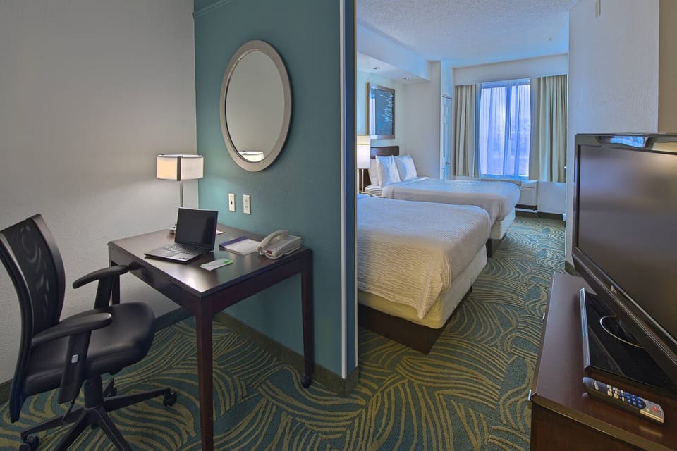 Feel at home with a work nook and comfortable beds.
