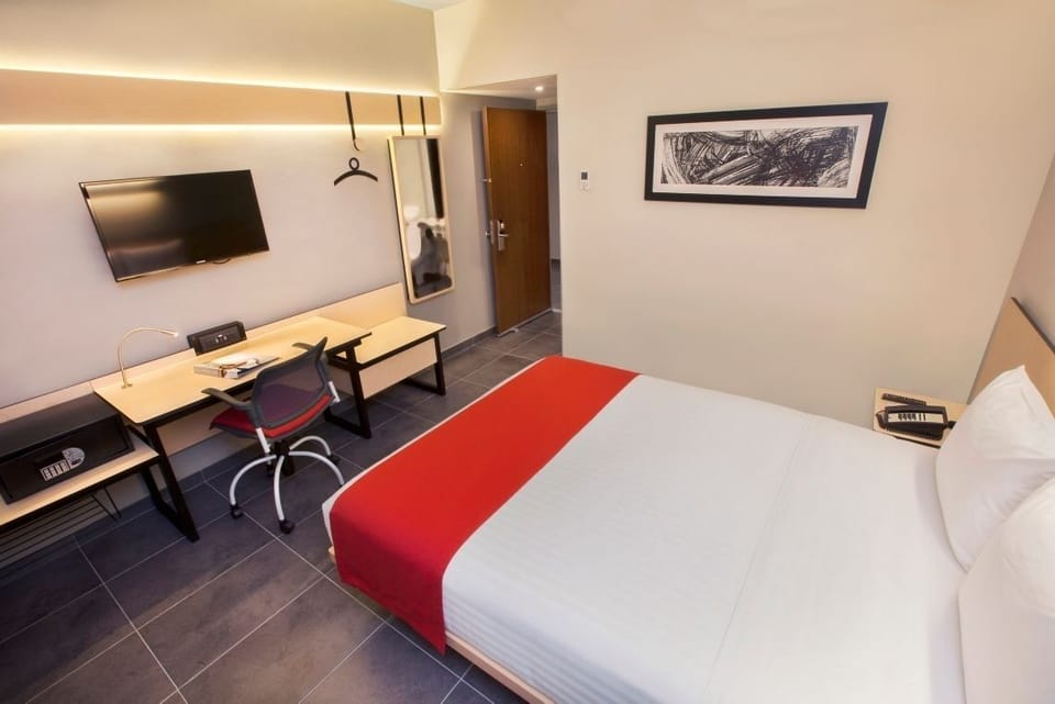 Settle into a calm space with roomy desk and lighting.