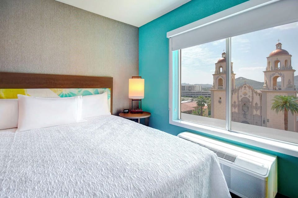 Wake up to iconic views beside crisp, cloudlike bedding.