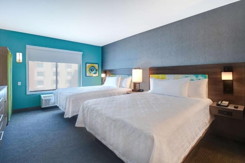 Unwind in a bright, spacious room with two cozy beds.