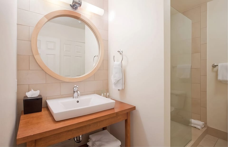 Start your day with a bright vanity and glass shower