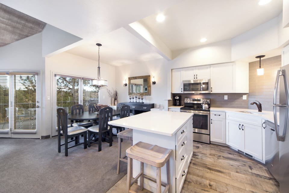 Cook and connect in the airy kitchen with dining space.