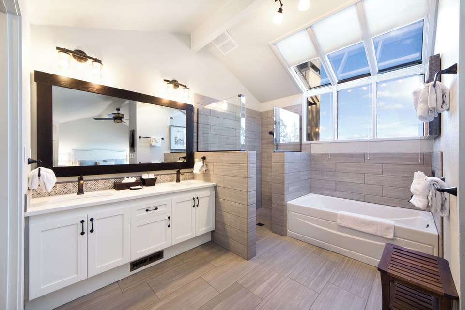Refresh in a spa-like bath with soaking tub and skylights