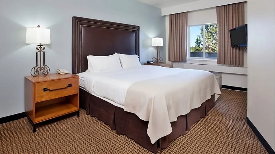 Recharge on a plush king bed after a full day out