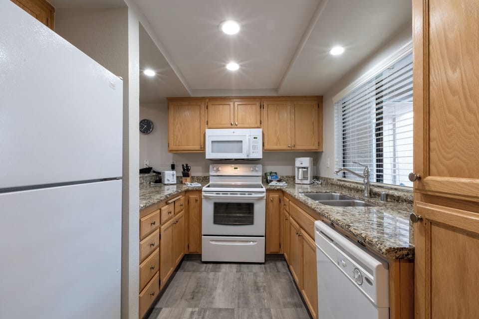 Cook comfortably with full-size appliances and generous granite counters.