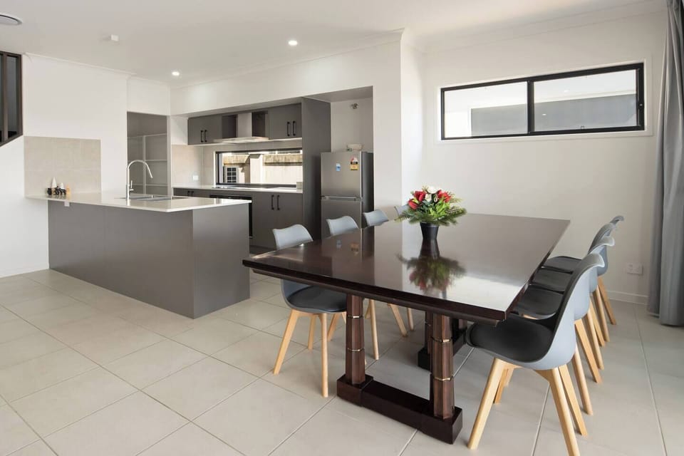 The large dining area offers a comfortable setting for family meals or dinner with friends.