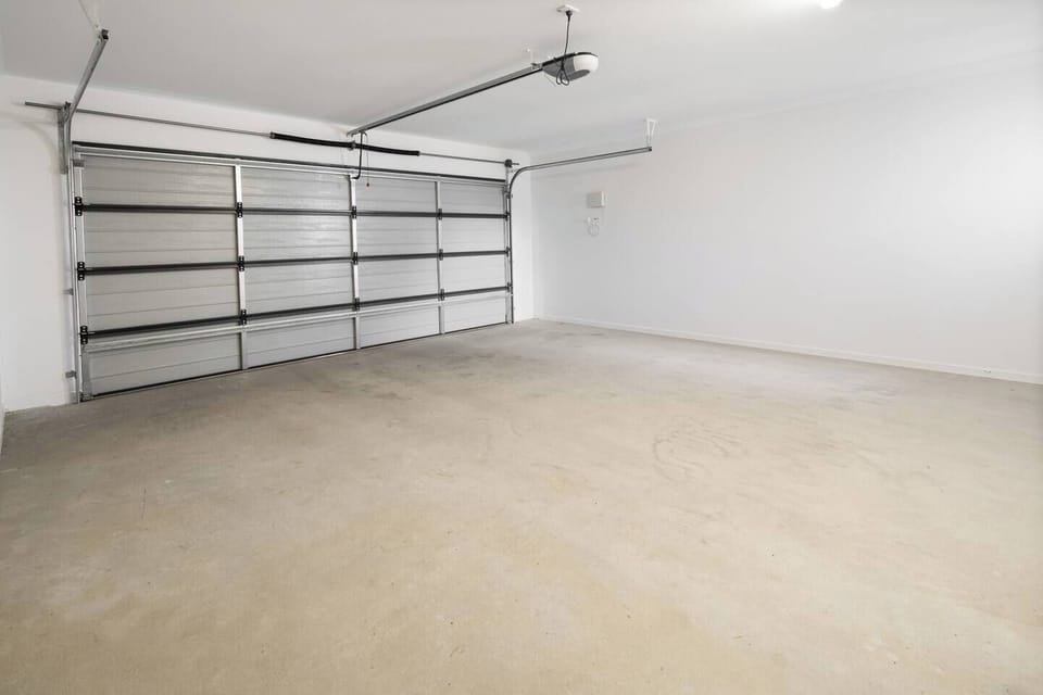 The spacious double garage ensures secure parking for up to four vehicles, with additional free street parking available.