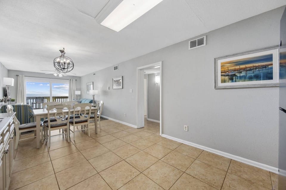 View from Kitchen into Dining, Living Area and entry into bedrooms