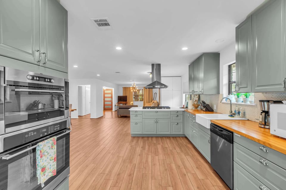 Cook while staying connected — the kitchen opens directly to the dining and living areas for a warm, social atmosphere.