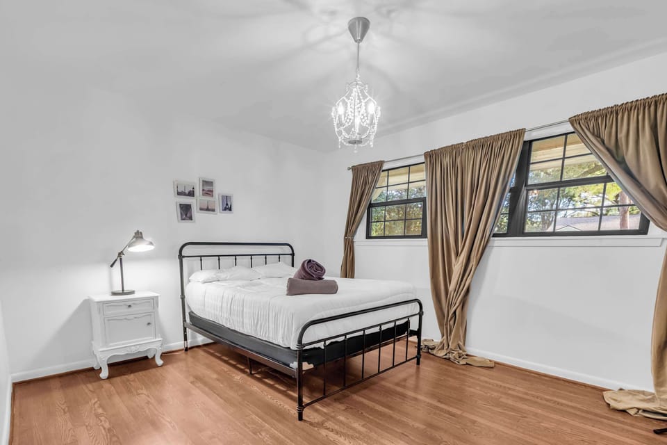 Bright and airy with warm curtains and a minimalist style — perfect for a restful night’s sleep.