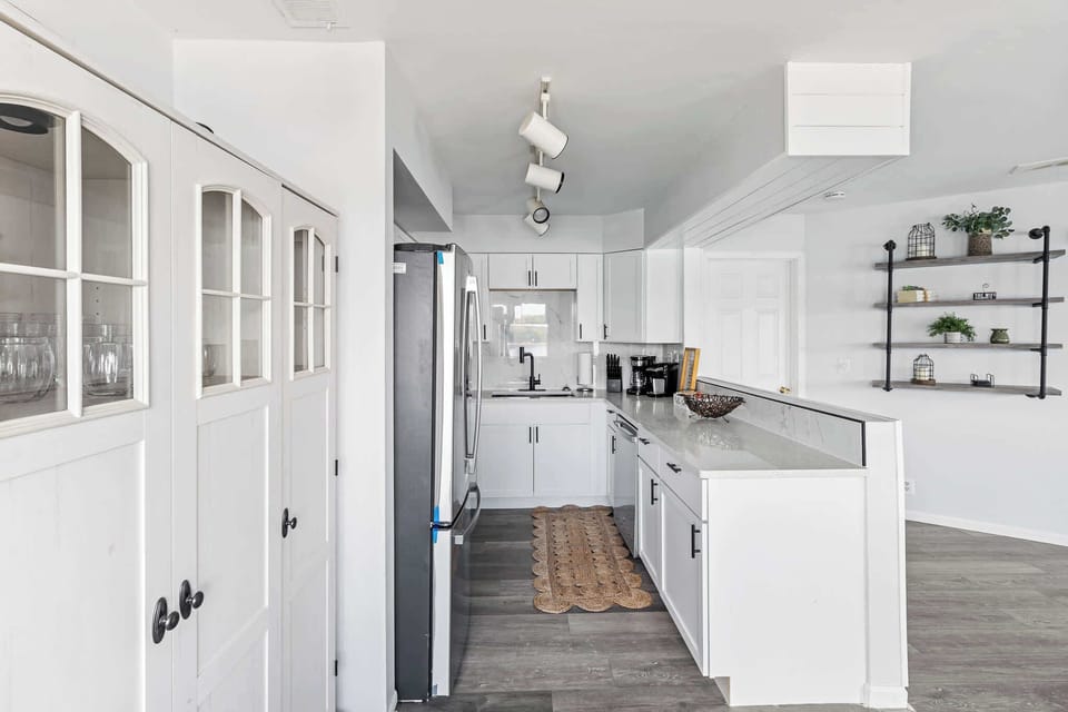 Another view of the kitchen showcasing bright finishes & everyday functionality.

