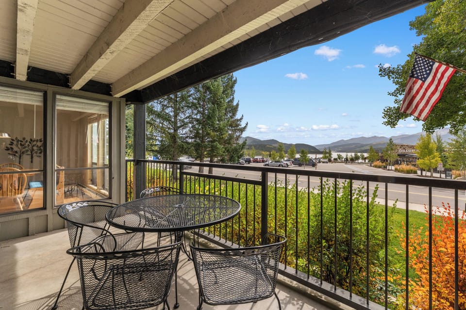 Your private balcony offers stunning mountain views as you enjoy morning coffee at your outdoor dining set.