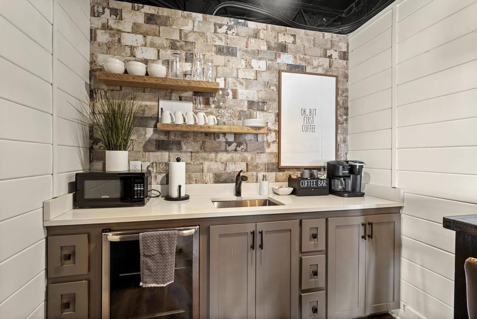 Kitchenette: Enjoy your morning brew at the charming coffee bar in this stylish space!