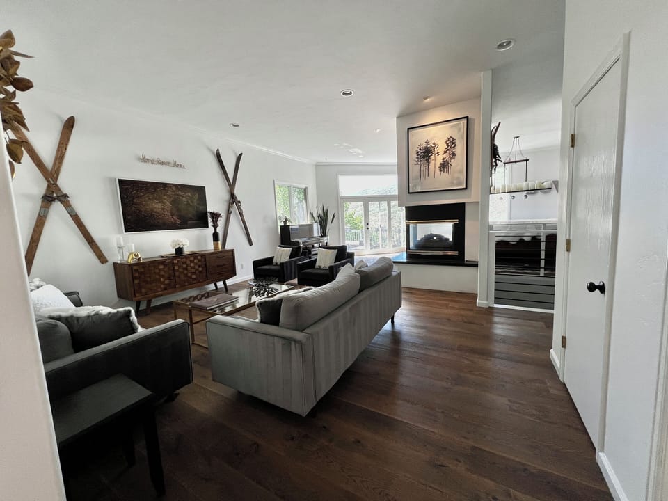 Welcome home! Living room as you enter. Connected to dining room and kitchen