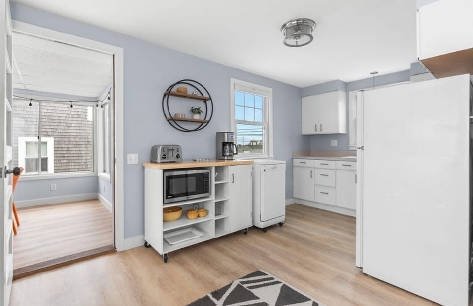 Kitchen with cookware basics, including drip and single serve coffee makers.