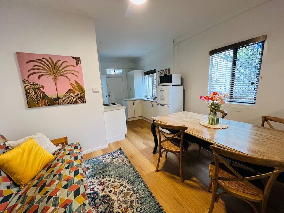 Cosy dining area with a stylish table and warm décor, perfect for meals or relaxing between adventures.
