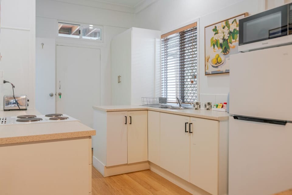 Bright and functional kitchen with all essentials for cooking during your stay.