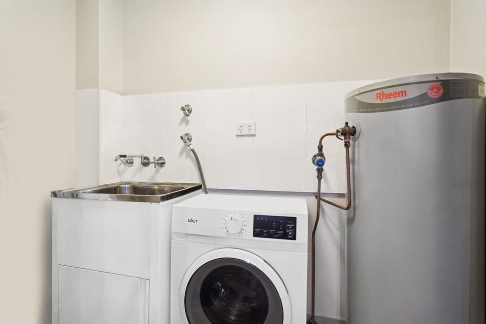 Laundry with a washing machine within the apartment