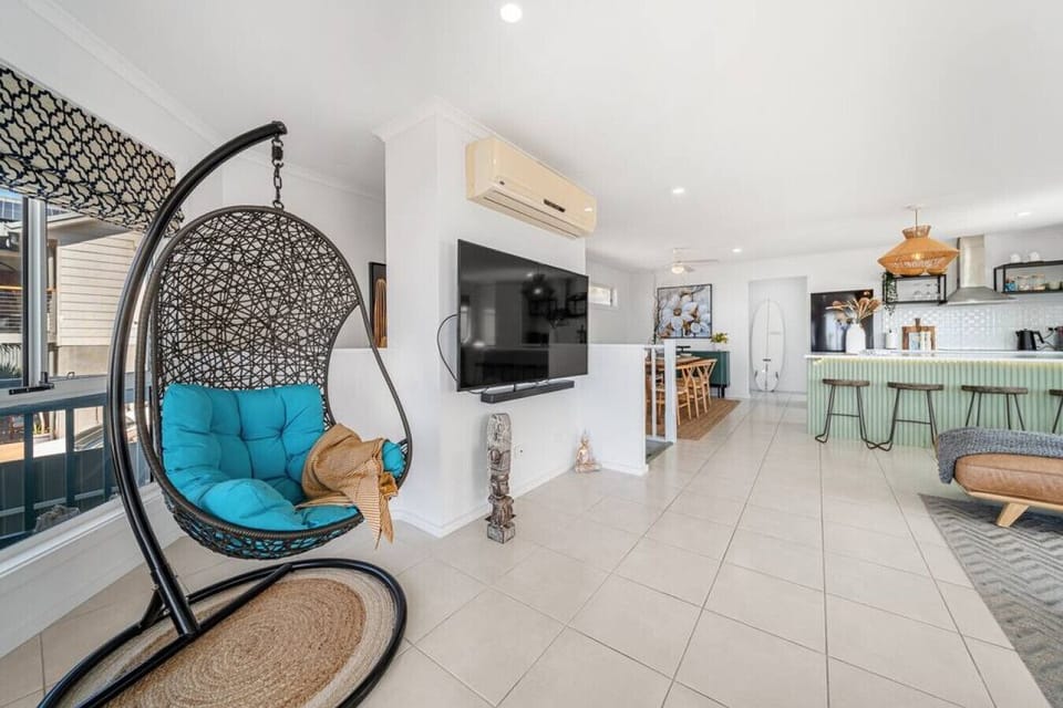 Sink into the hanging egg chair by the window and enjoy a quiet moment with the ocean stretching out in the distance.