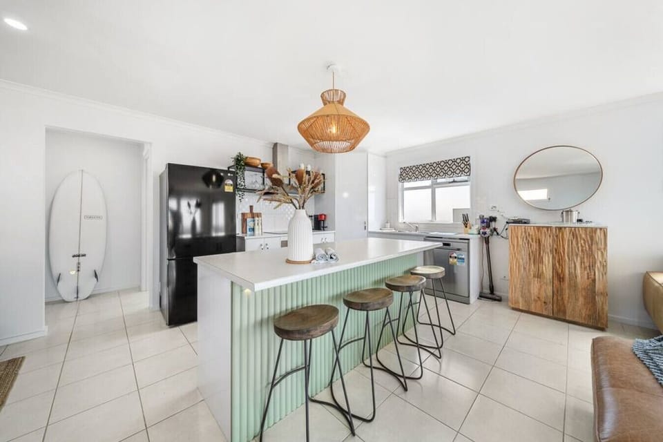 Modern appliances and generous bench space make everything from quick breakfasts to shared dinners simple.