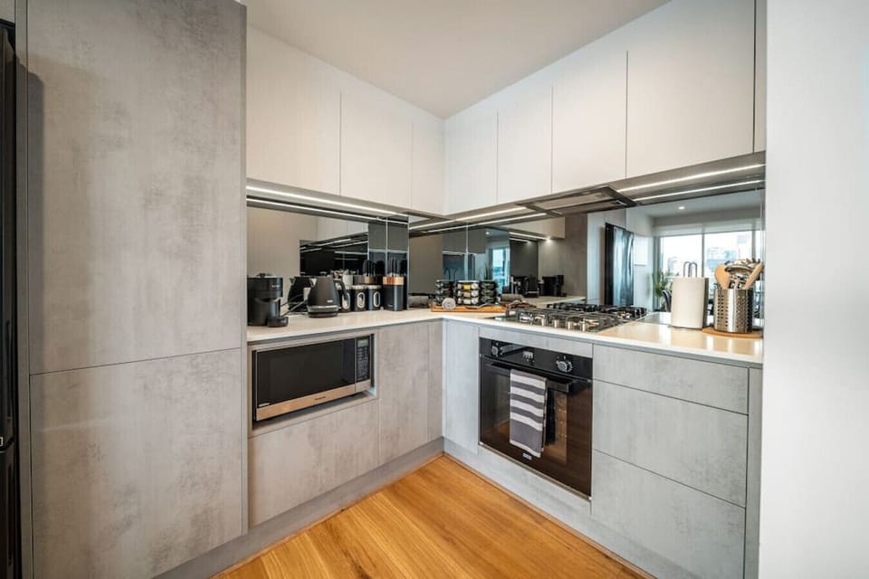 From morning coffee to evening dinners, the sleek kitchen invites effortless everyday living.