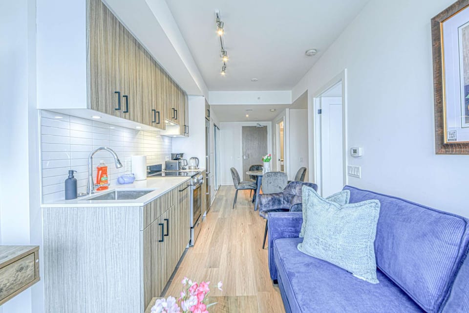 Bright and stylish open-concept living with a fully-equipped kitchen.