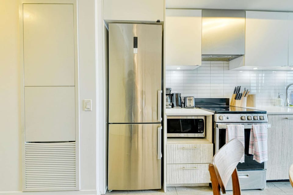 The kitchen is equipped with modern appliances and a clean design.