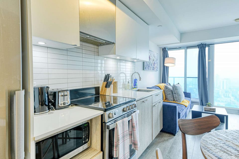 A sleek kitchen with all the essential appliances.