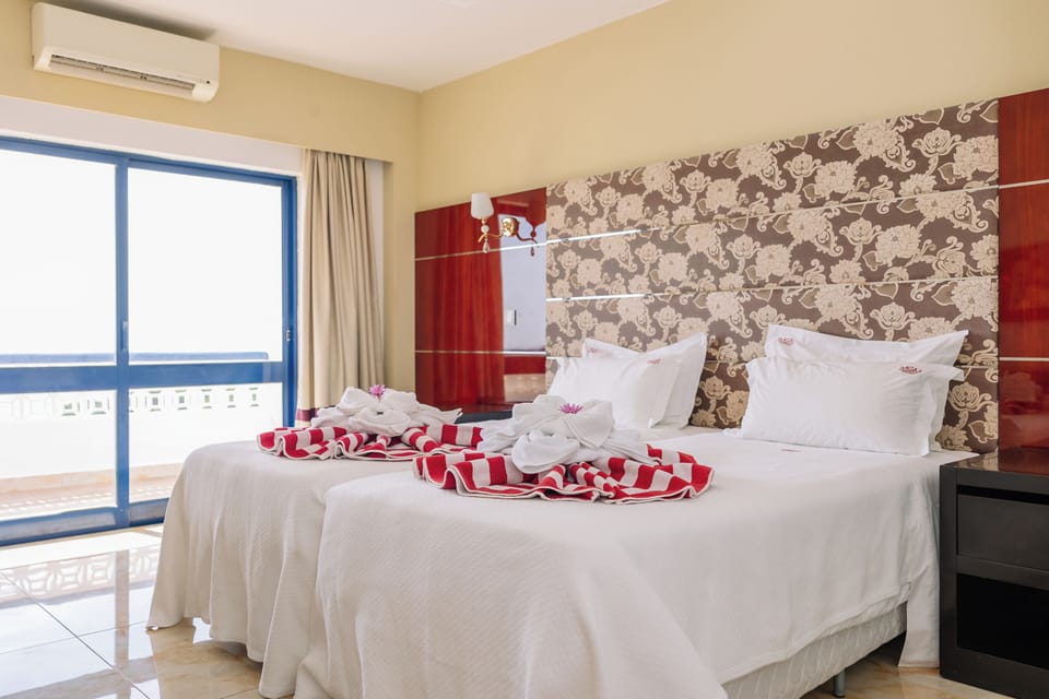 Bedroom. Exact unit will be assigned upon arrival. Views, colors and decor may vary.