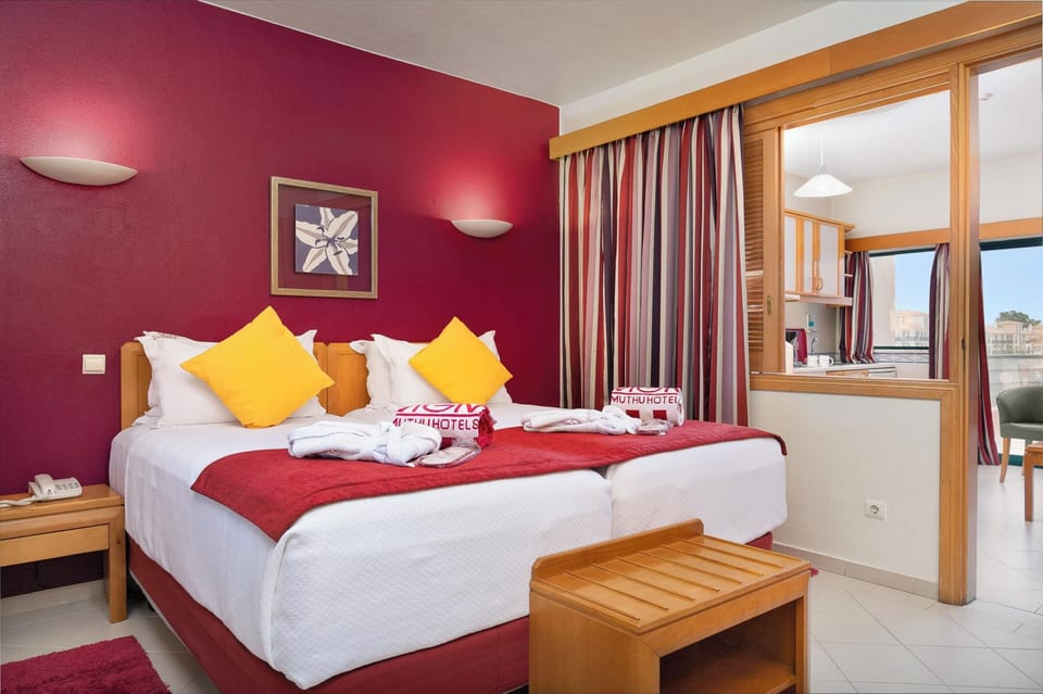 Unwind in crisp linens with a warm, colorful retreat.