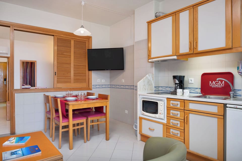 Gather for easy meals with a convenient, well-equipped kitchenette.
