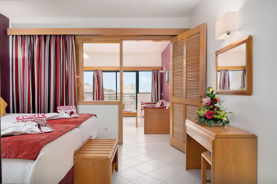 Step into an airy bedroom with space to unpack.