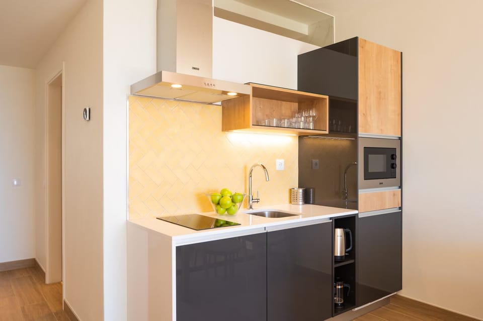 Cook simple favorites with a full hob, sink, and microwave.