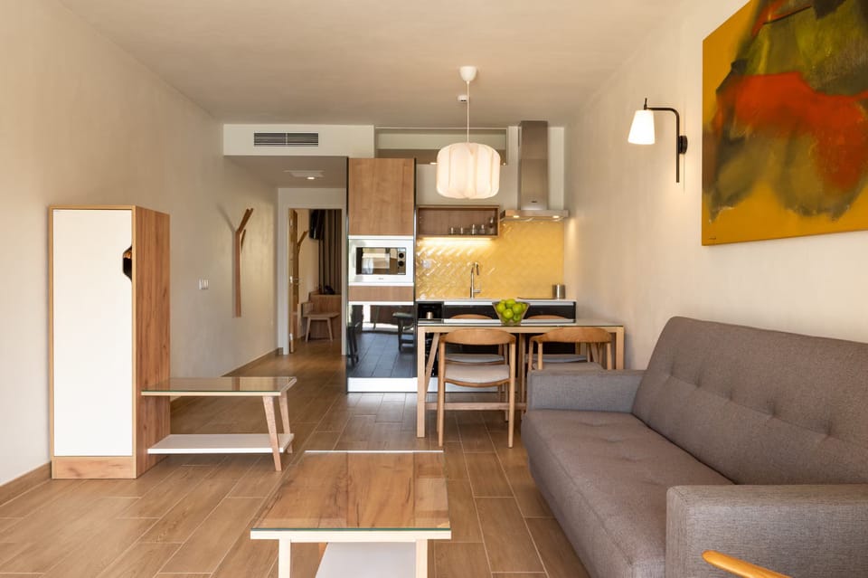 Gather for easy meals in this open-plan retreat.