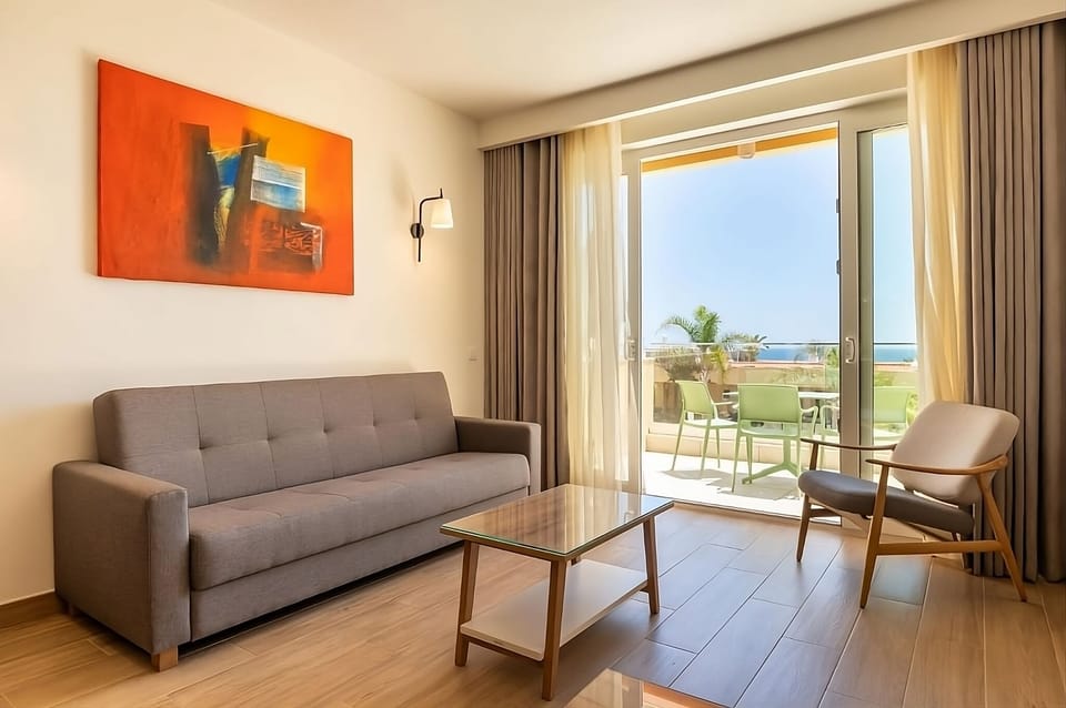 Soak up sea views from your sunlit living room.