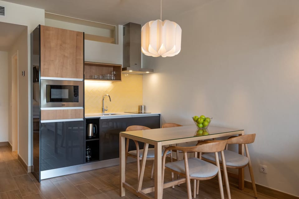 Cook effortlessly in the sleek kitchenette, then linger over dinner.