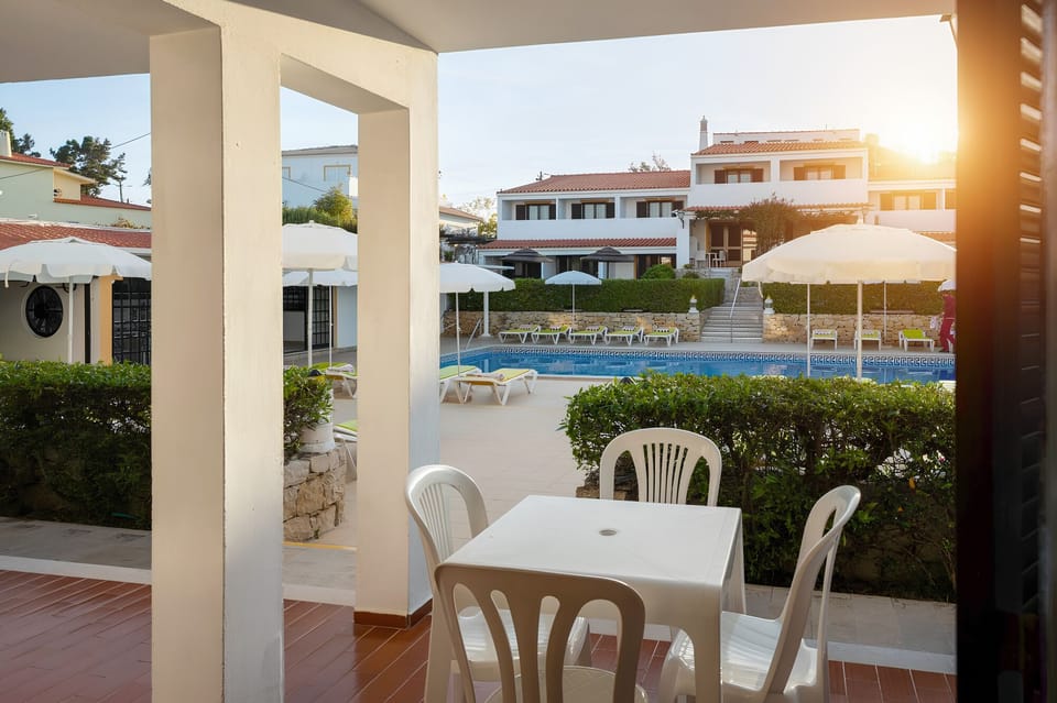 Linger outdoors with poolside ambience right beyond your table.