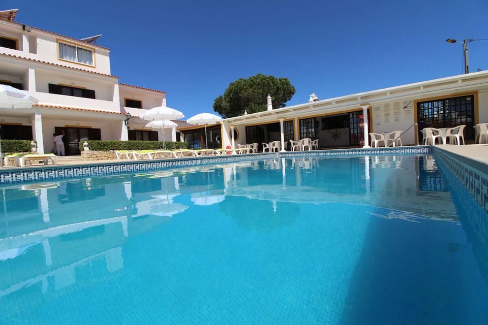 Dive into sparkling blue waters under endless sunny skies.