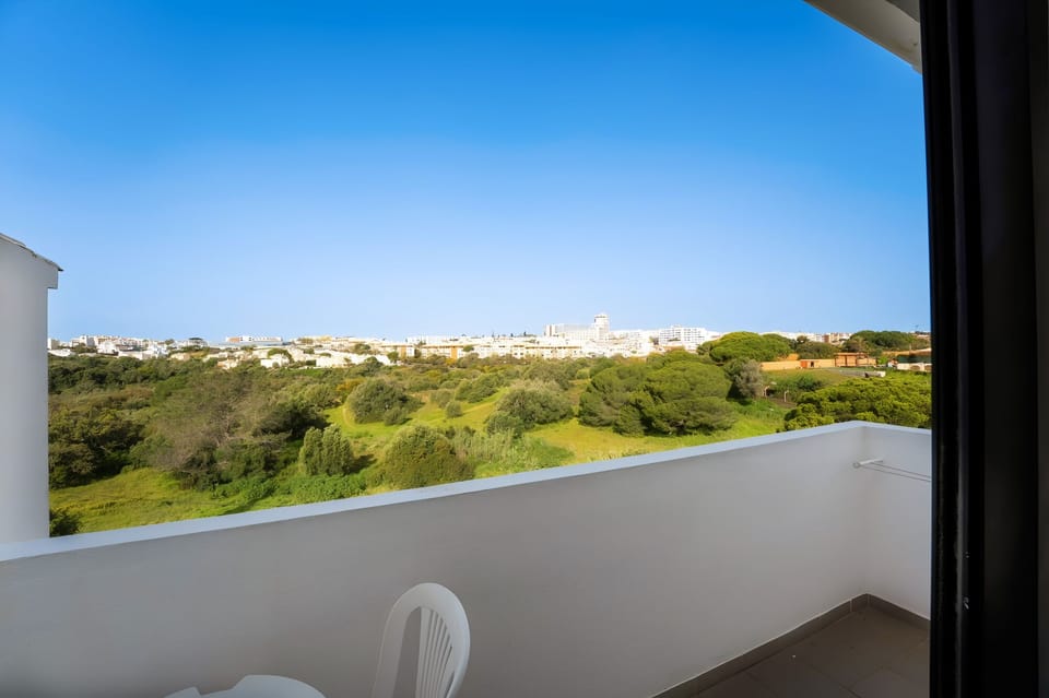 Sip morning coffee overlooking wide-open green landscapes.