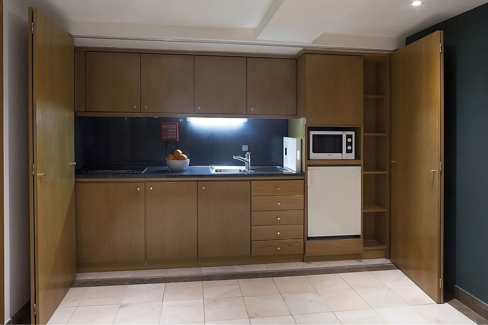 Cook simple meals easily with microwave, sink, and storage.