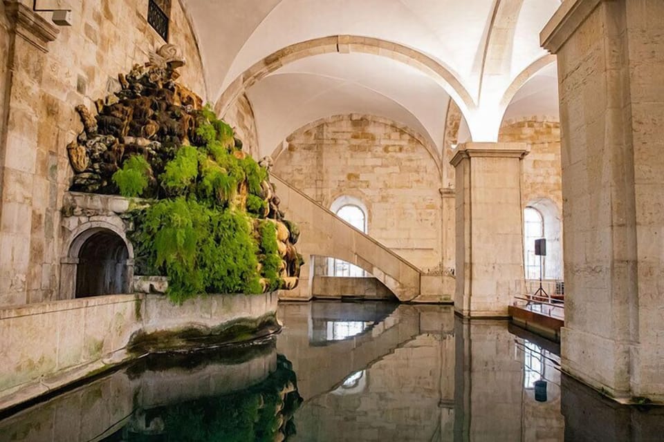 Step into awe beneath soaring arches beside tranquil water.