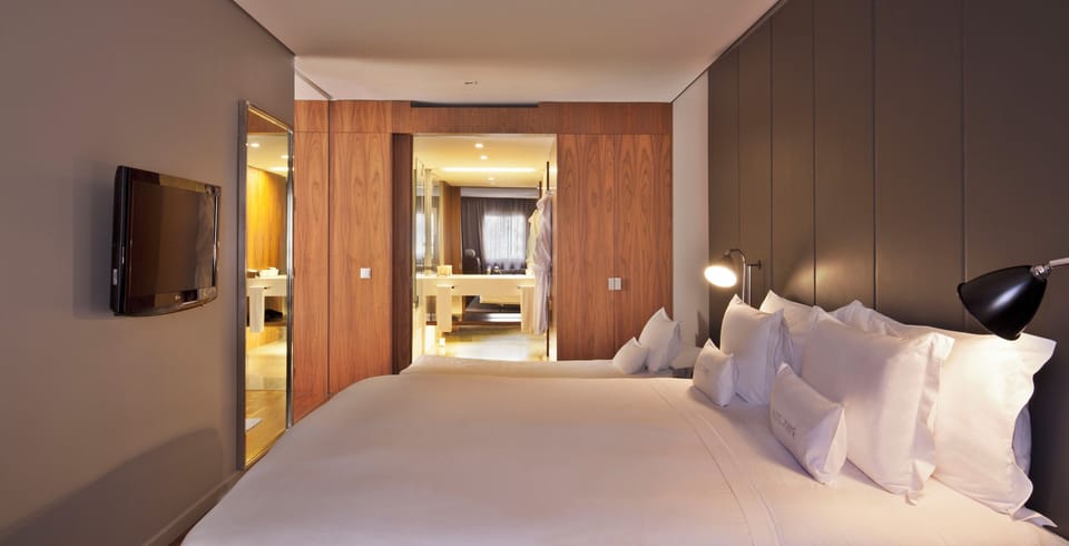 Relax in a serene bedroom with TV comfort and family space.