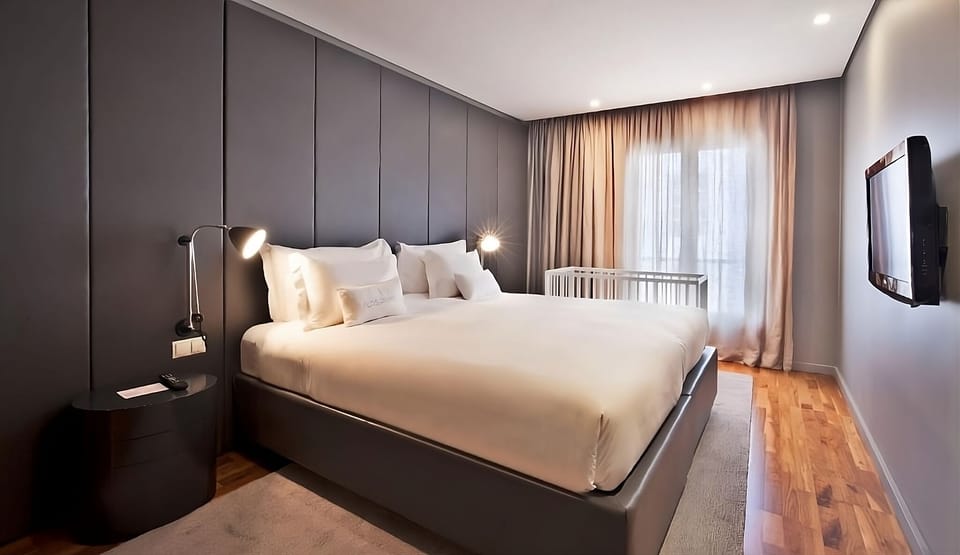 Sink into a cloud-soft bed under warm, calming lighting.